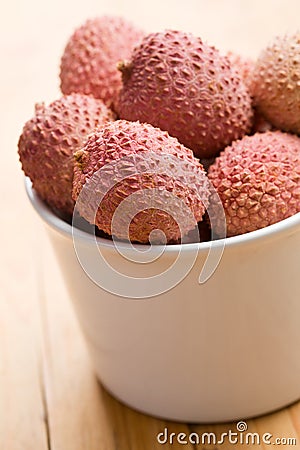 Tasty litchi fruit in ceramic bowl Stock Photo