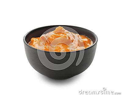 Tasty orange sauce in bowl on white background Stock Photo