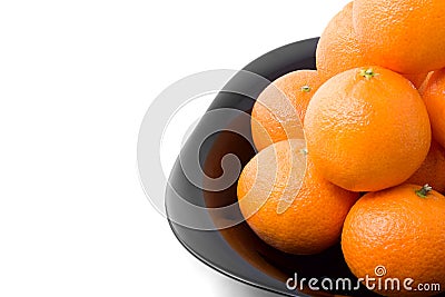 Tasty orange tangerins on black plate isolated Stock Photo