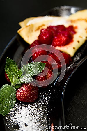 Tasty pancakes with red strawberries Stock Photo