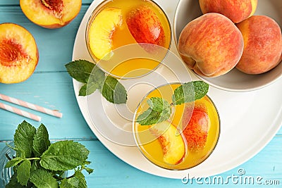 Tasty peach cocktail in glasses on table Stock Photo