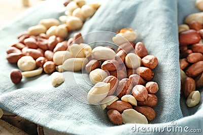 Tasty peanuts on cloth, closeup Stock Photo