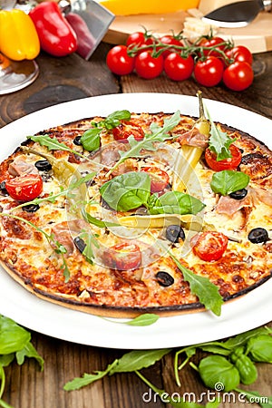 Tasty pizza on wooden table, top view. Stock Photo