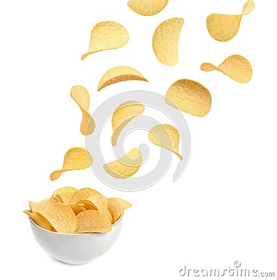 Tasty potato chips falling into blow Stock Photo