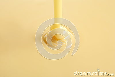 Tasty pouring condensed milk as background, closeup Stock Photo