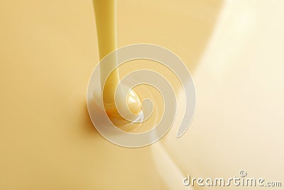 Tasty pouring condensed milk as background, space for text Stock Photo