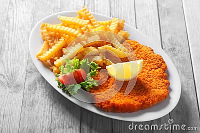 Tasty Recipe of Crumbled Escalope with Fried Fries Stock Photo