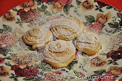 Tasty rose shaped coockies on holiday plate.Tasty rose shaped sunflower pastry. Stock Photo