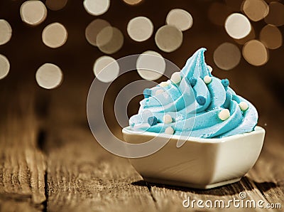 Tasty Sky Blue Frozen Yogurt on Wooden Table Stock Photo