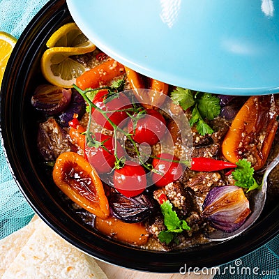 A Tasty spicy beef with various vegetables cooked in tagine Stock Photo