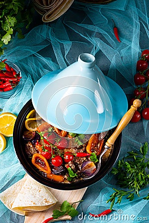 A Tasty spicy beef with various vegetables cooked in tagine Stock Photo