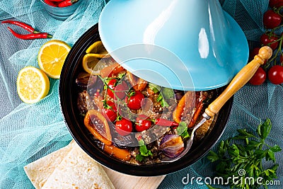 A Tasty spicy beef with various vegetables cooked in tagine Stock Photo