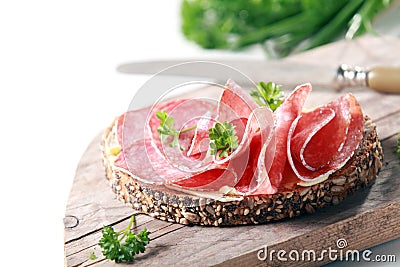 Tasty spicy Italian salami on wholegrain bread Stock Photo