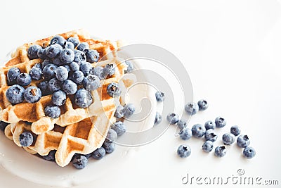 Tasty stacked waffles with blueberries Stock Photo