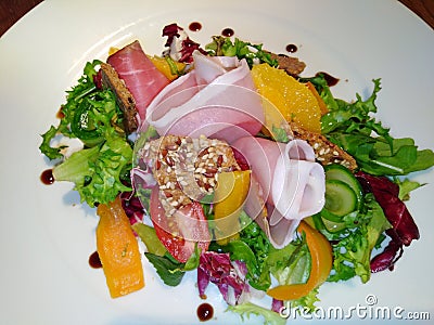 Tasty summer salad with serano and Orange supreme Stock Photo