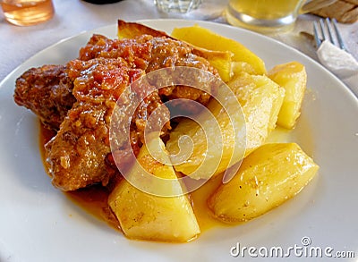 A tasty `sutzoukia` meat balls served with potatoes, traditional Greek plate. Stock Photo