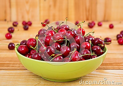 Tasty sweet cherry on wooden background Stock Photo