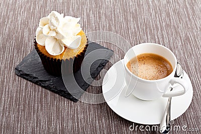 Tasty sweet cupcake and hot aromatic espresso coffee Stock Photo