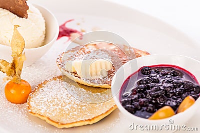 Tasty sweet pancakes with vanilla icecream and topping Stock Photo