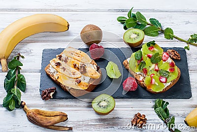 Tasty sweet sandwiches with bananas, nuts and chocolate, kiwi, s Stock Photo