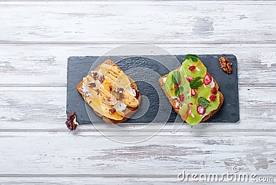 Tasty sweet sandwiches with bananas, nuts and chocolate, kiwi, s Stock Photo