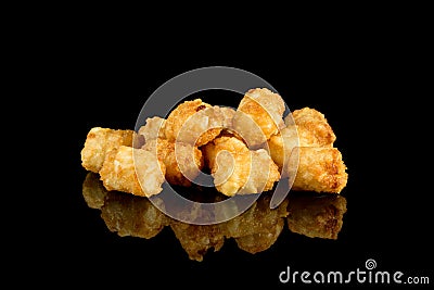 Tasty Taters Fries with reflection isolated on black background Stock Photo