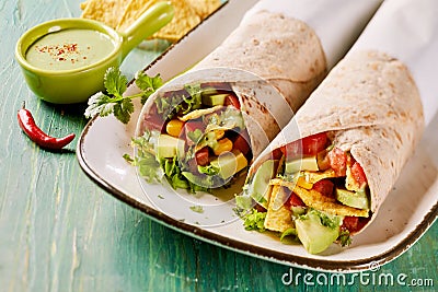 Tasty Tex-Mex vegetarian avocado tortilla wraps Stock Photo