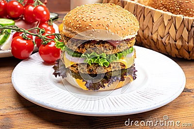 Tasty vegetarian cheeseburgers with round patties or burgers made from grains, vegetables and legumes Stock Photo