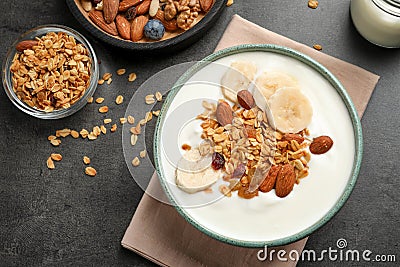 Tasty yogurt with banana and granola for breakfast Stock Photo
