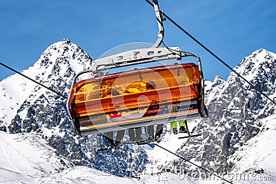 Ski lift and peak Lomnicky stit in High Tatras mountains in resort Tatranska Lomnica, Slovakia Editorial Stock Photo