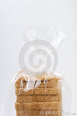 Tatsy toast bread in the plastic package against white background.Vertical image Stock Photo