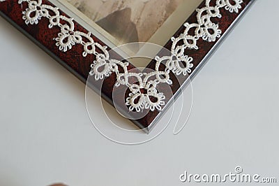 Closeup Corner detail Fine Thread Tatted Edging Picture Frame Stock Photo