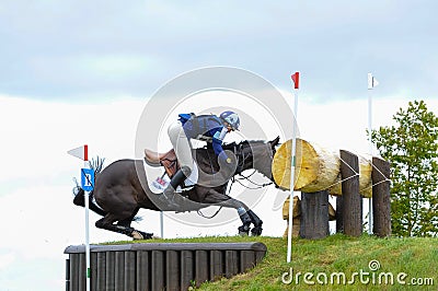 Tattersalls horse show in Ireland, black horse refuse to jump over obstacle with male rider, jockey Editorial Stock Photo