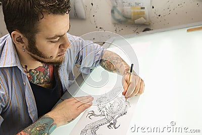 Tattoo artist. Stock Photo