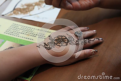 A tattoo artist in Little India in Singapore Editorial Stock Photo