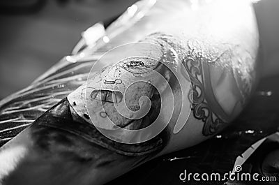 Tattoo artwork on men's leg Editorial Stock Photo