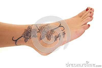 Tattoo close rose foot Stock Photo