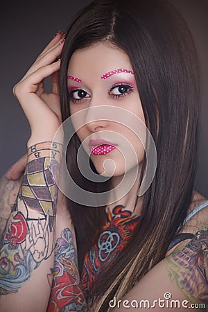 Tattoo model with bright make-up Stock Photo
