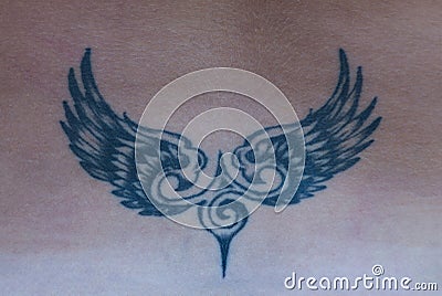 The tattoo in the shape of wings on the back Stock Photo