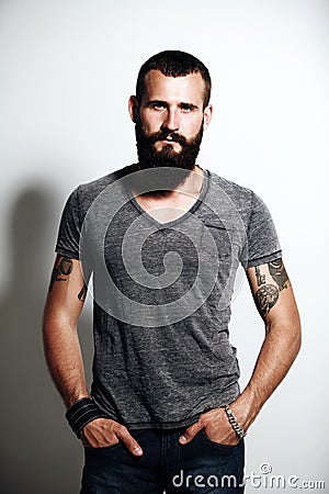 Tattooed bearded man Stock Photo