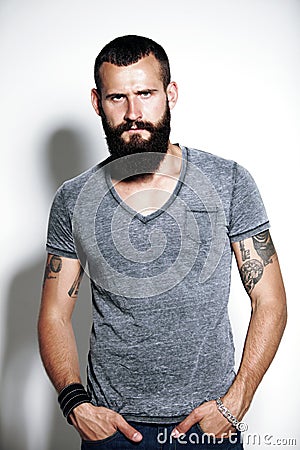 Tattooed bearded man Stock Photo