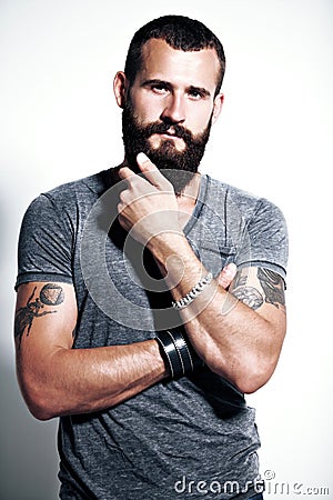 Tattooed bearded man Stock Photo