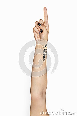 Tattooed hands showing index finger Stock Photo