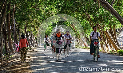 Women biking on street Editorial Stock Photo