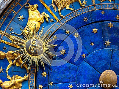 Taurus astrological sign on ancient clock. Detail of Zodiac wheel with Sun and Taurus Stock Photo