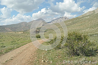 Taurus Mountains on the background of sky. Vertices covered with snow. Stock Photo