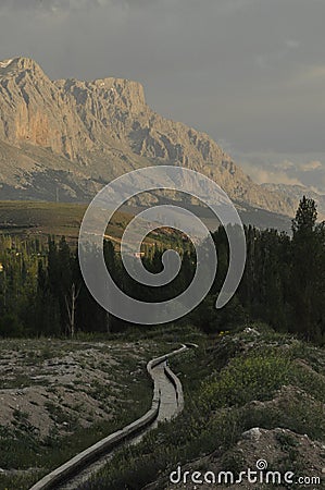 Taurus Mountains on the background of sky. Vertices covered with snow. Stock Photo