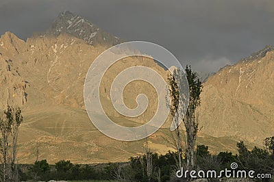 Taurus Mountains on the background of sky. Vertices covered with snow. Stock Photo