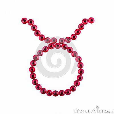 Taurus. Sign of the zodiac of red rhinestones on a white background. Stock Photo