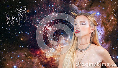 Taurus Zodiac Sign. Astrology and horoscope. Beautiful woman Taurus on the galaxy background Stock Photo